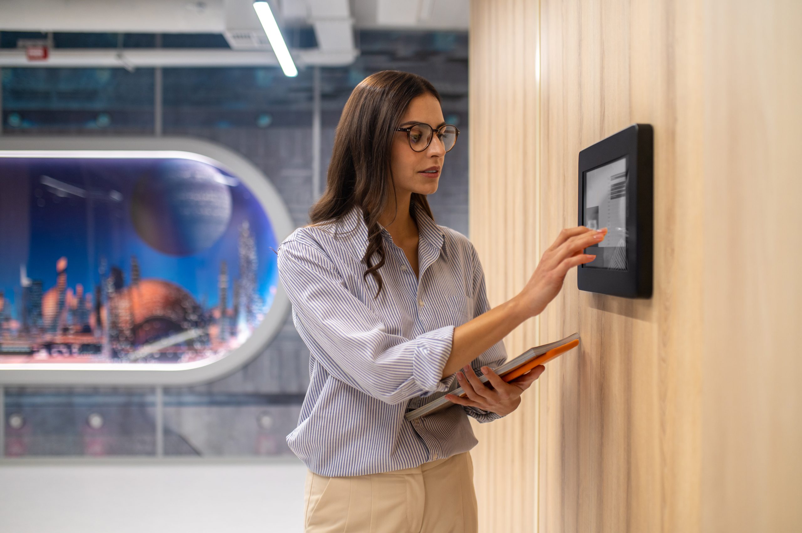 woman-touching-control-panel-wall-corridor-scaled Access Control: The Ultimate 2024 Guide